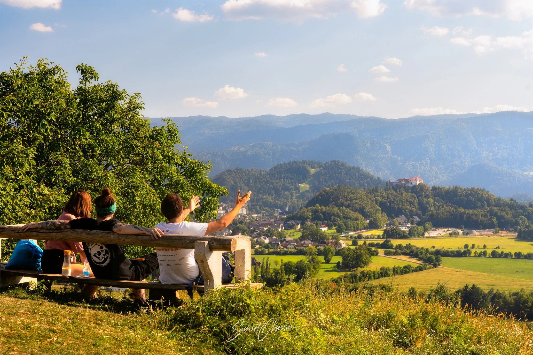 Locals enjoying the view of castle Bled in the distance