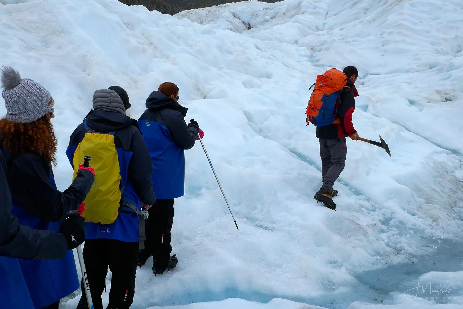 Everyone lining up behind the guide at Fox Glacier hell hike