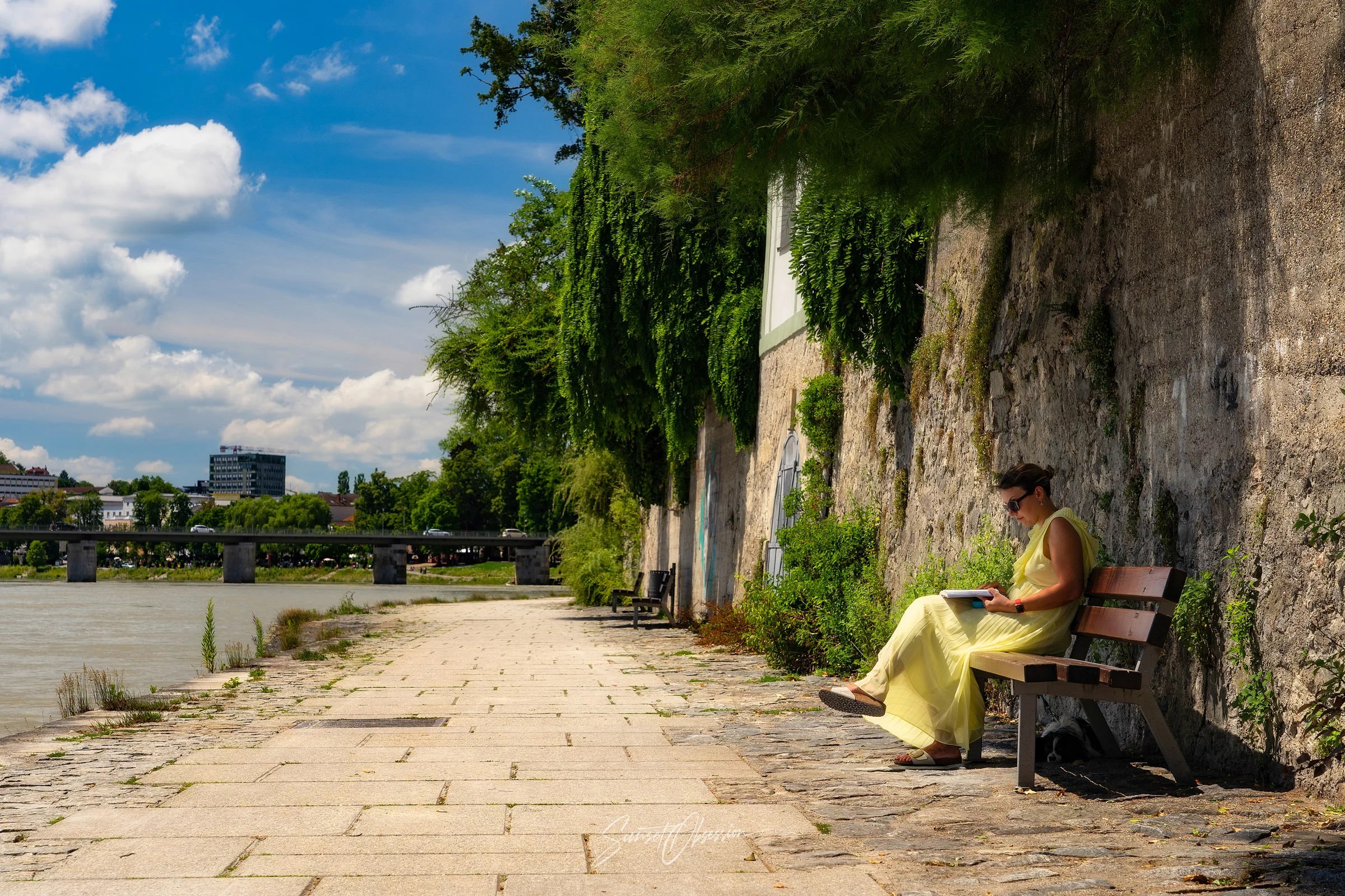 Relaxed summer day on the Inn promenade in Passau, Germany
