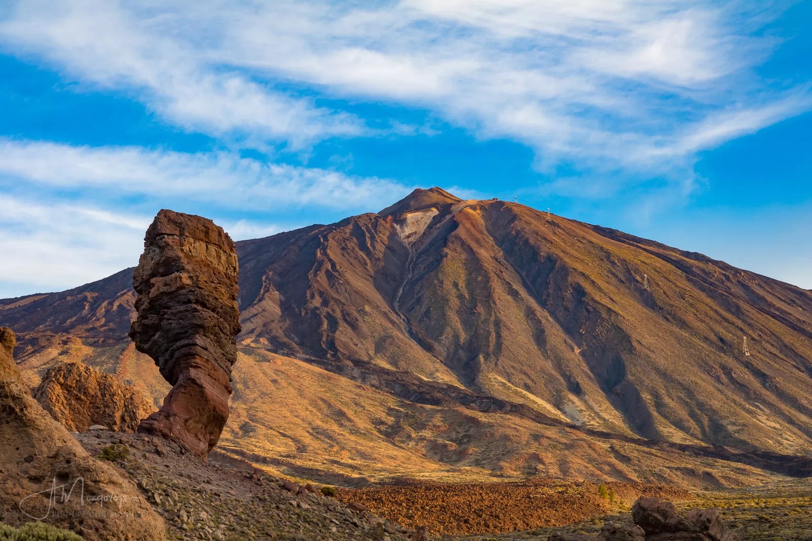 A classical postcard view of Teide with God's Finger rock in the foreground