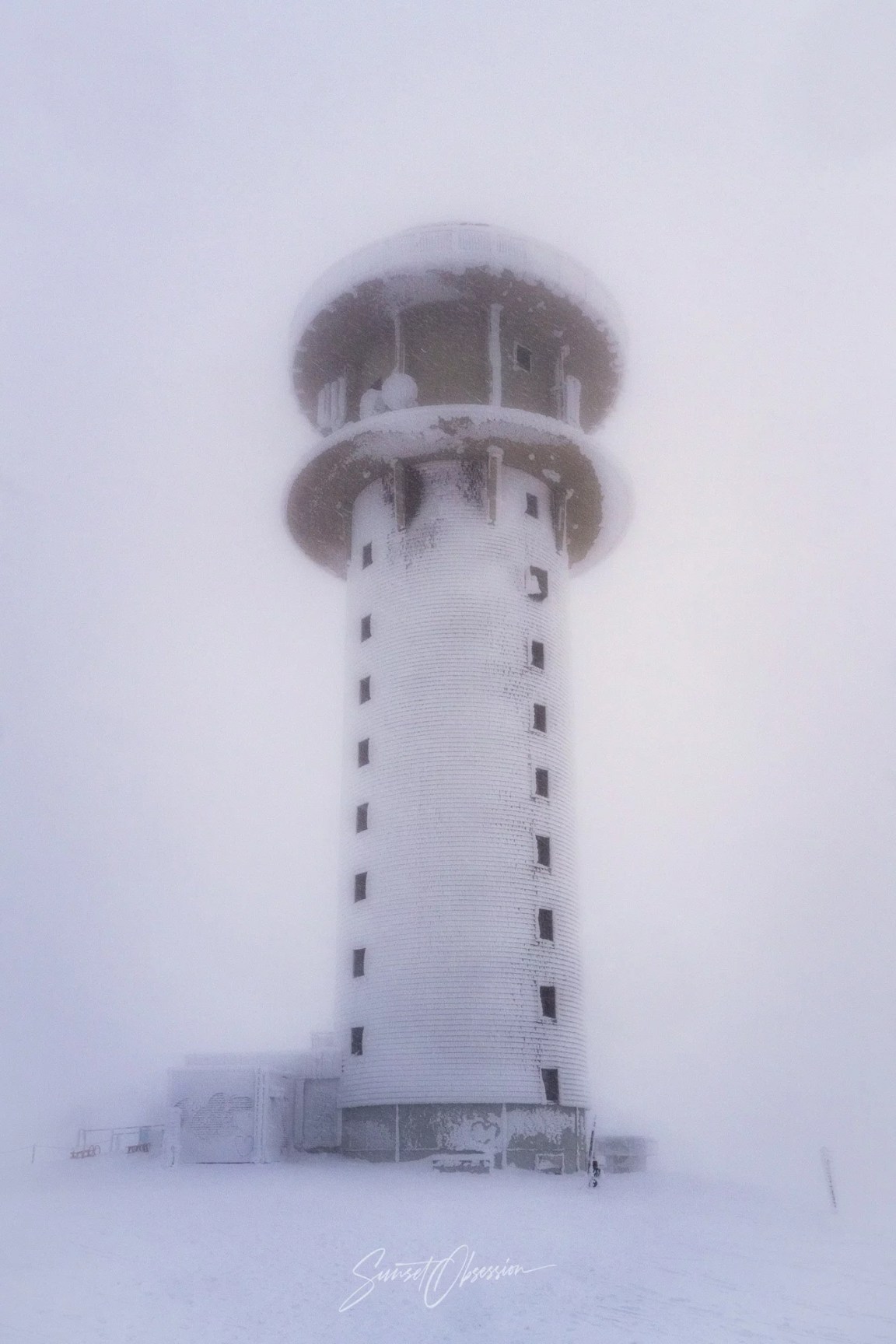 Tower at the peak of Feldberg during a snowstorm
